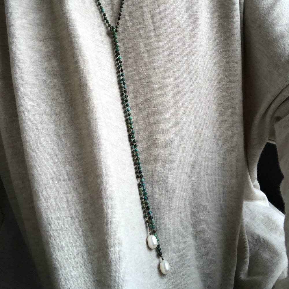 Turquoise beaded necklace with white pearls on end